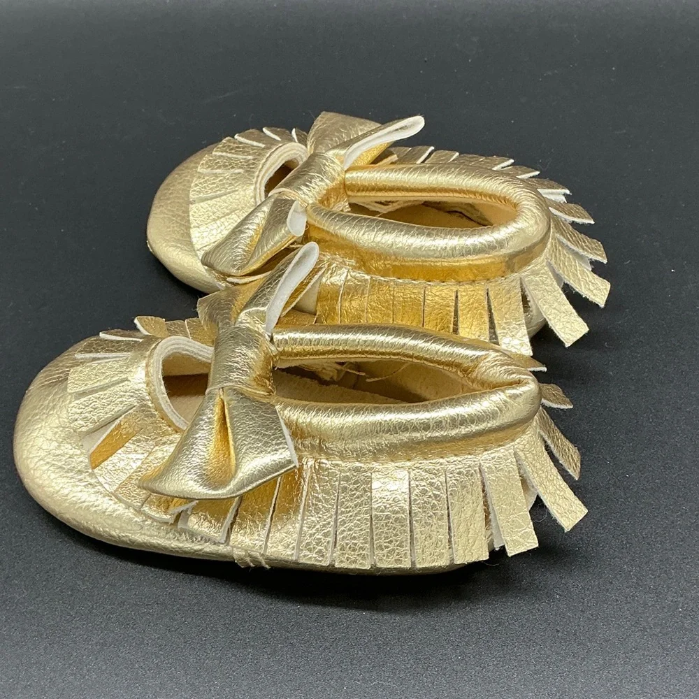 Romirus Metallic Gold Bow Fringe Moccasins